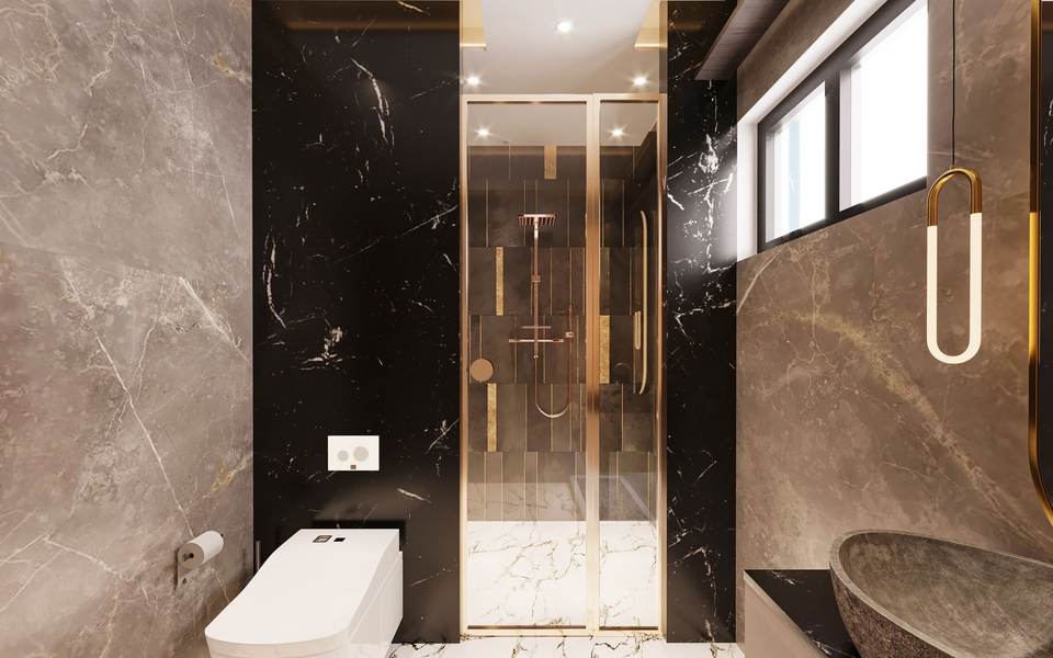 Marble-look bathroom with a glass walk-in shower and brushed gold fixtures